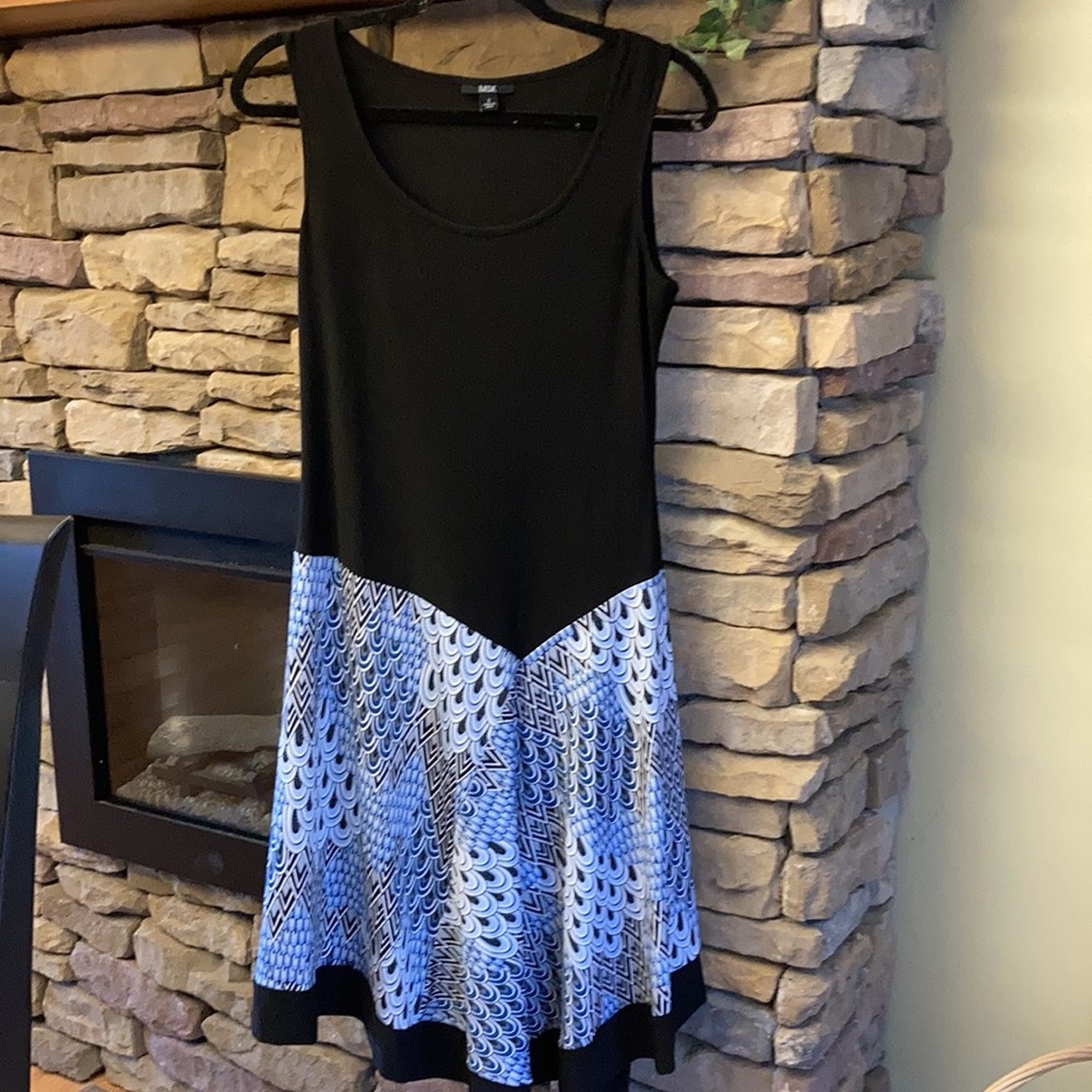 Tank top dress with asymmetrical waist line.